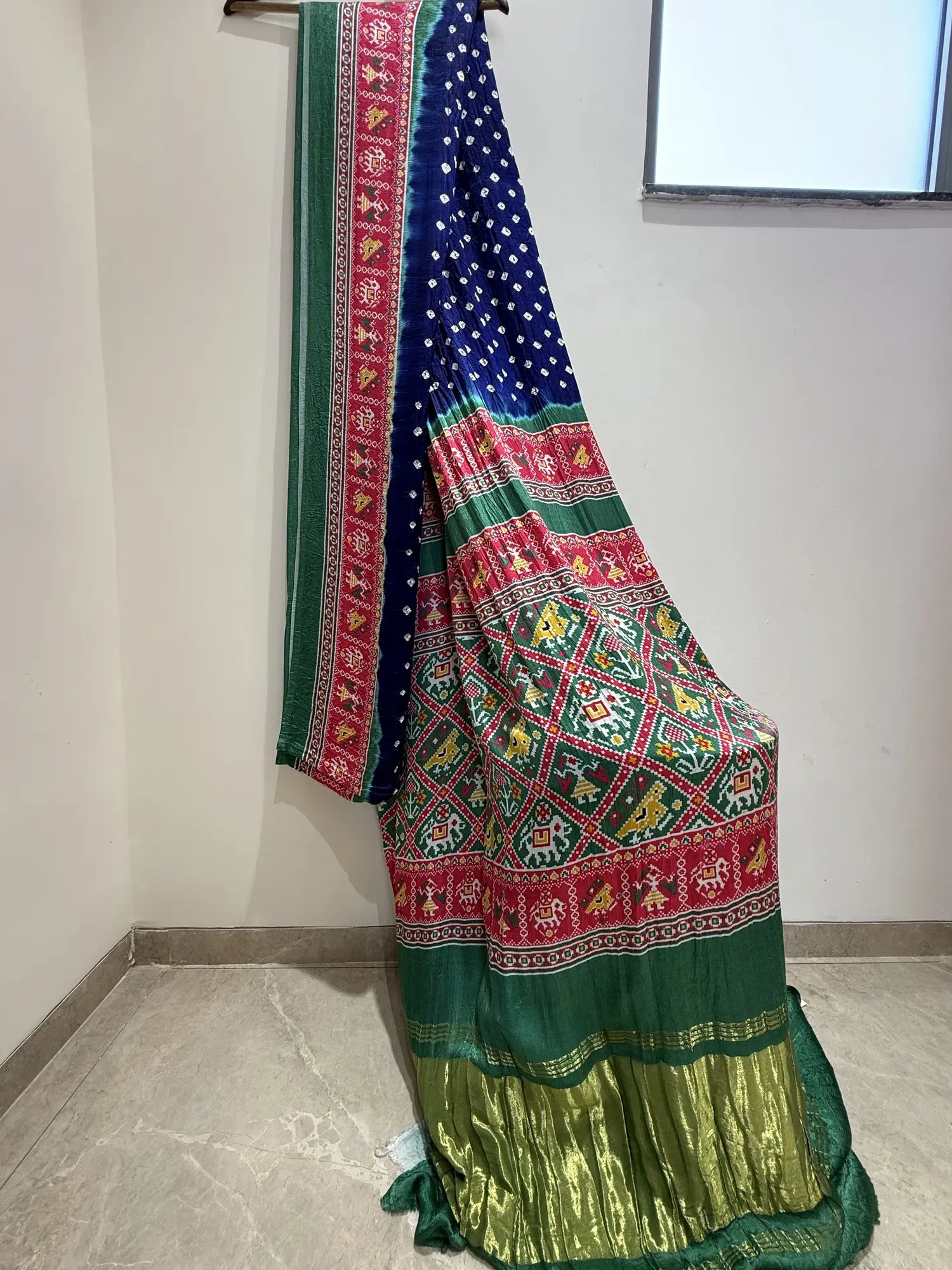 Blue & Green Bandhani Patola Art Silk Saree with Multicolour Animal Motifs & Zari Border for Festive & Wedding Wear.