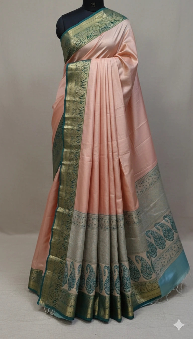 Peach Pink Silk Saree with Green Zari Border and Peacock Pallu for Festive Wear.